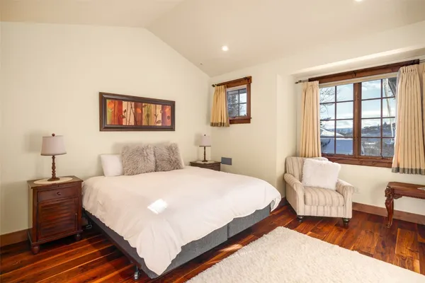 a bedroom with a bed and a couch
