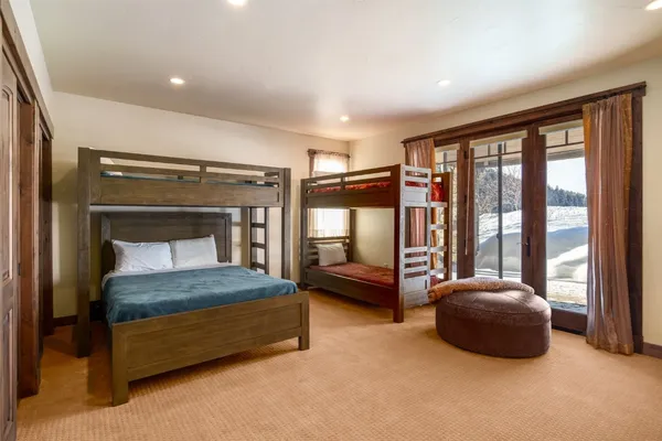 a bedroom with a bed and a couch