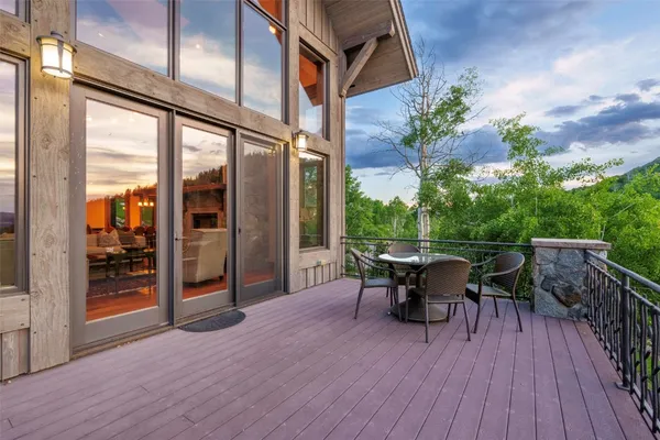 a view of a patio with a table and chairs