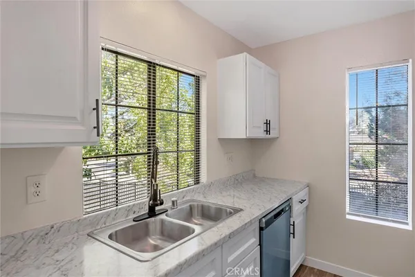 a kitchen that has a sink and a window