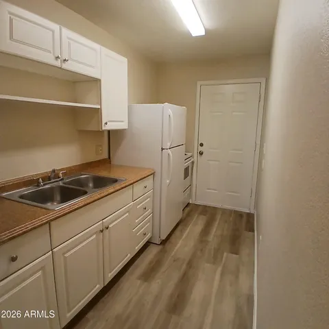 a kitchen with a sink and cabinets