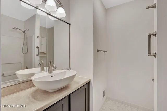 a bathroom with a sink and a mirror