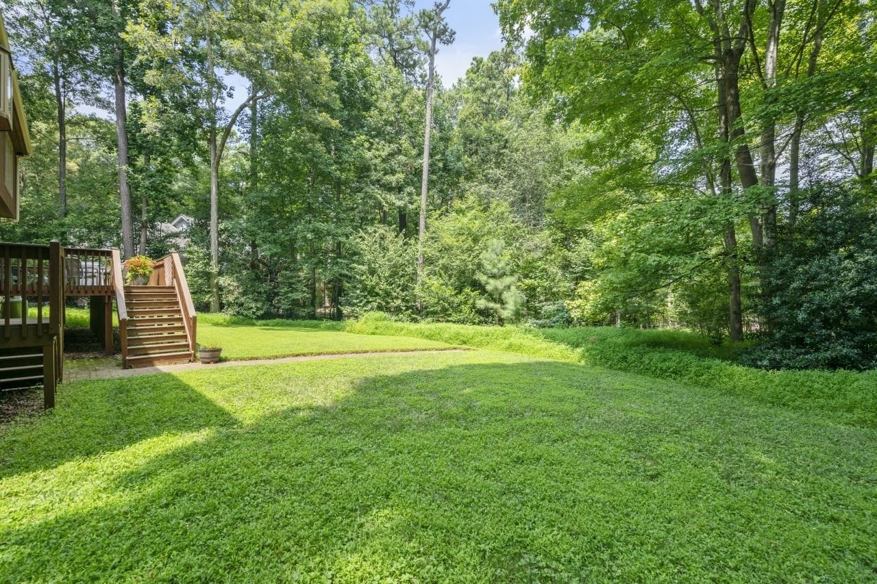 1932 Partridge Berry Drive Raleigh, NC 27606 - Photo 28 of 30 Flat Backyard Surrounded by Trees