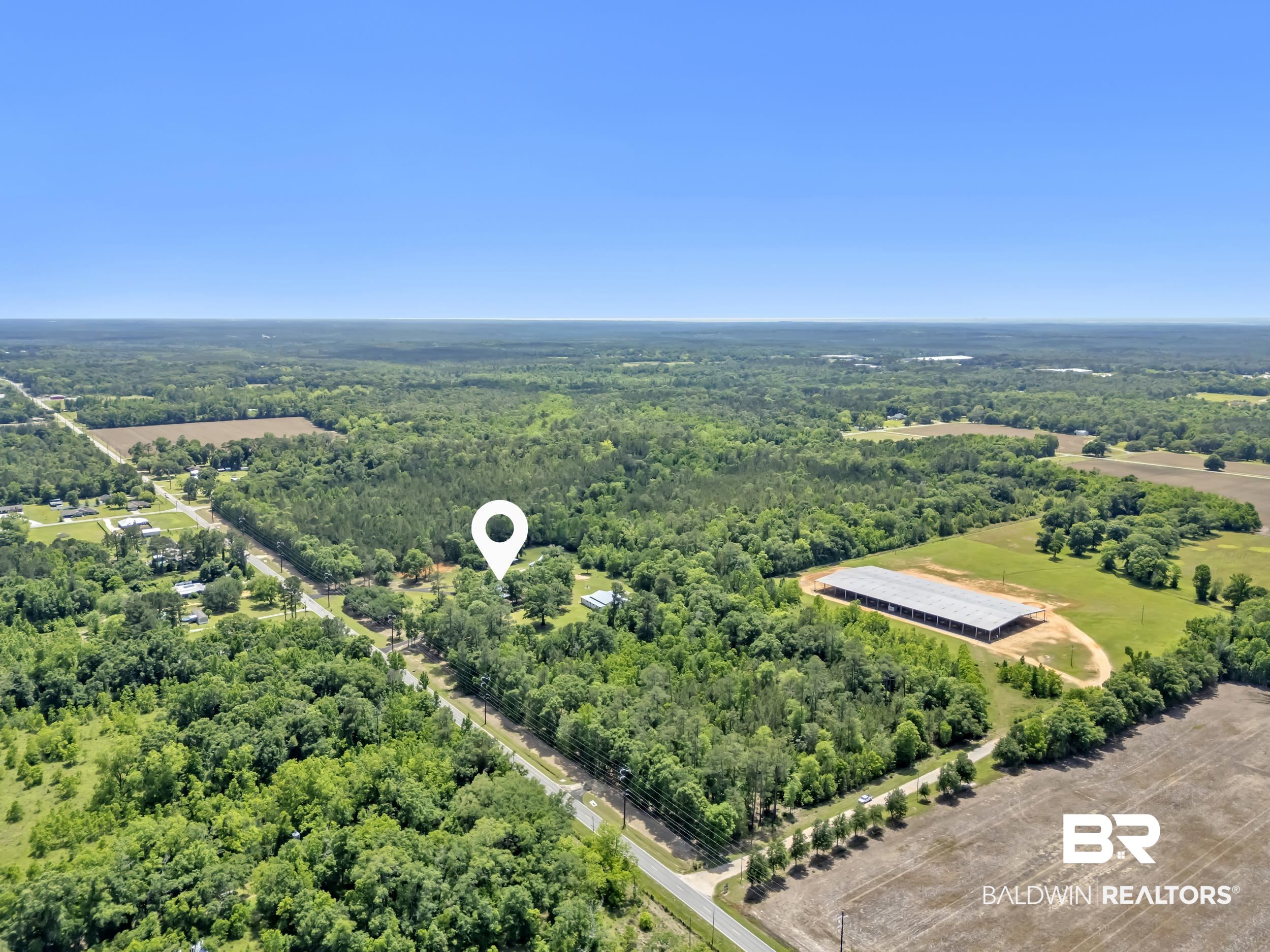 43199 Pine Grove Road Bay Minette, AL 36507 - Photo 27 of 71 Expansive land parcel featuring a main residence, additional outbuildings, and extensive tree coverage
