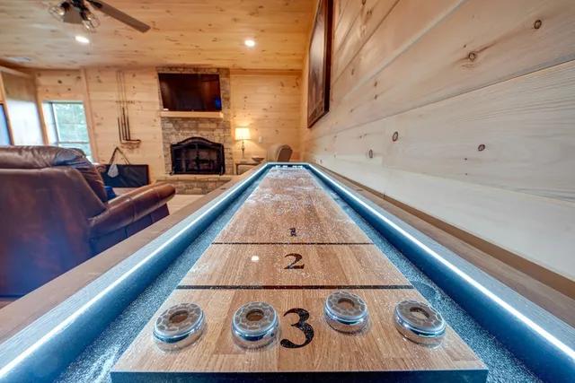 a living room with a couch and a fireplace