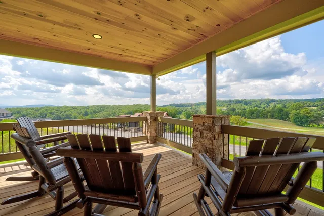 a view of a balcony with furniture