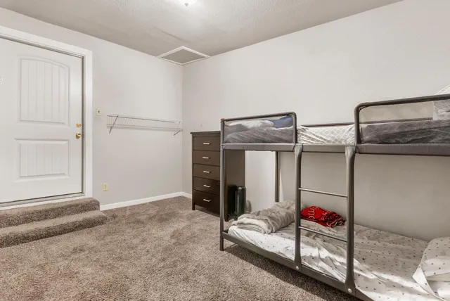 a bedroom with furniture and a shower