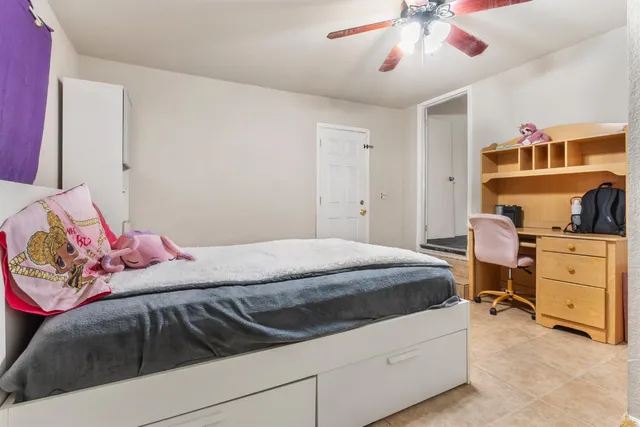 a bedroom with a bed and cabinets