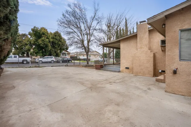 a view of a house with a snow in the yard