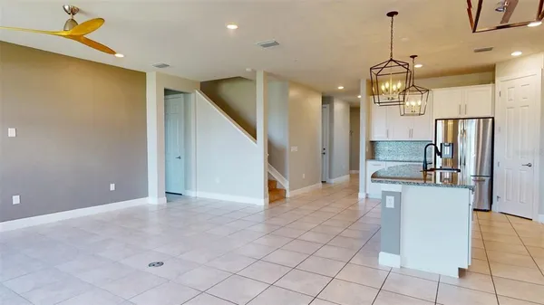 a view of livingroom with a ceiling fan