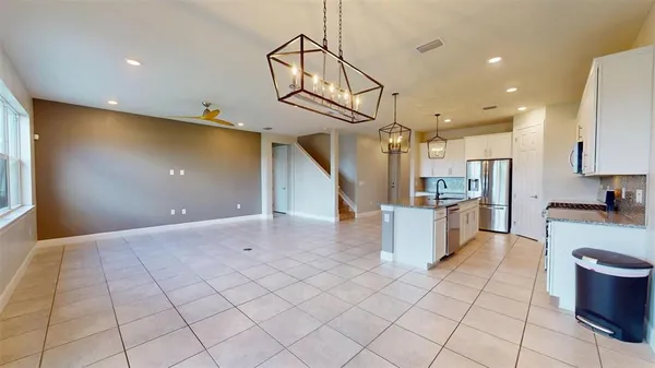 a bathroom with a granite countertop sink a toilet and a mirror