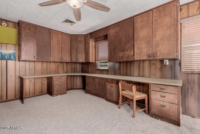 a view of kitchen with furniture and window