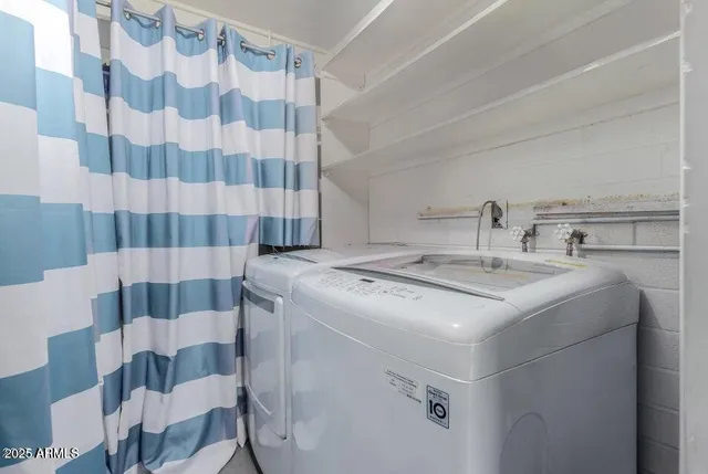 a utility room with dryer and washer
