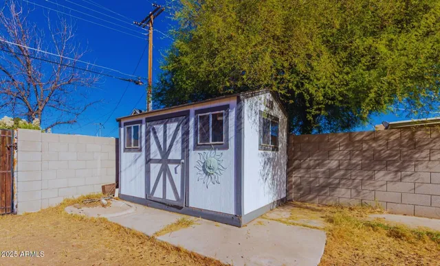a view of backyard with cabin