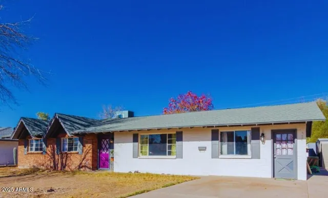 a front view of a house with a garage