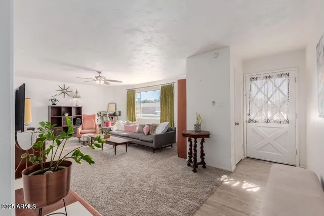 a living room with furniture and a window