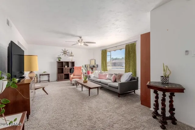 a living room with furniture and a window