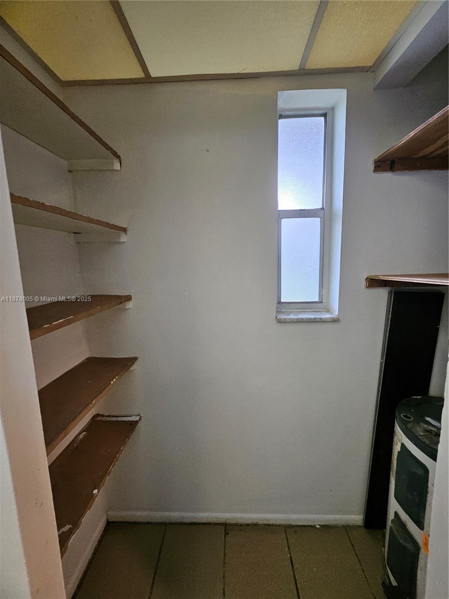 7820 South Colony Circle, Unit 102 Tamarac, FL 33321 - Photo 11 of 51 Large walk-in pantry in the kitchen