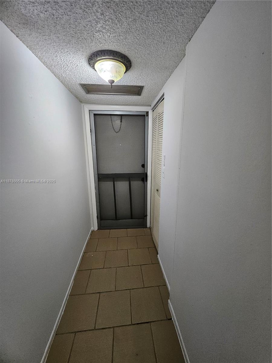 7820 South Colony Circle, Unit 102 Tamarac, FL 33321 - Photo 4 of 51 Entrance has a screened door as well