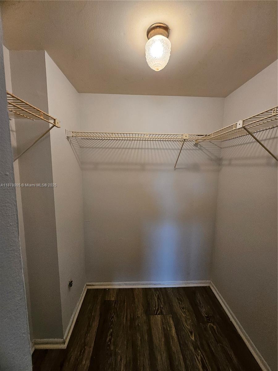 7820 South Colony Circle, Unit 102 Tamarac, FL 33321 - Photo 43 of 51 Guest Bedroom Walk-in closet