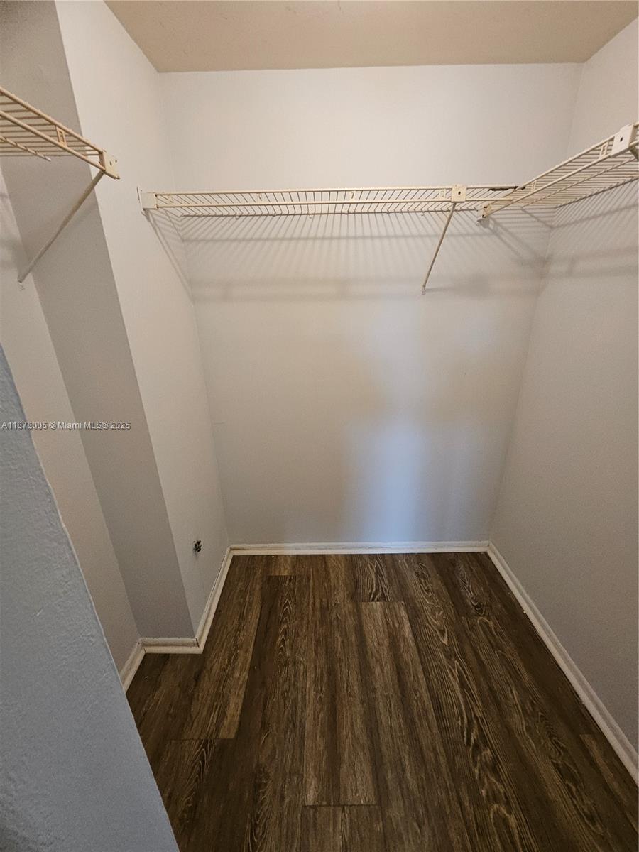 7820 South Colony Circle, Unit 102 Tamarac, FL 33321 - Photo 44 of 51 Guest Bedroom Walk-in closet