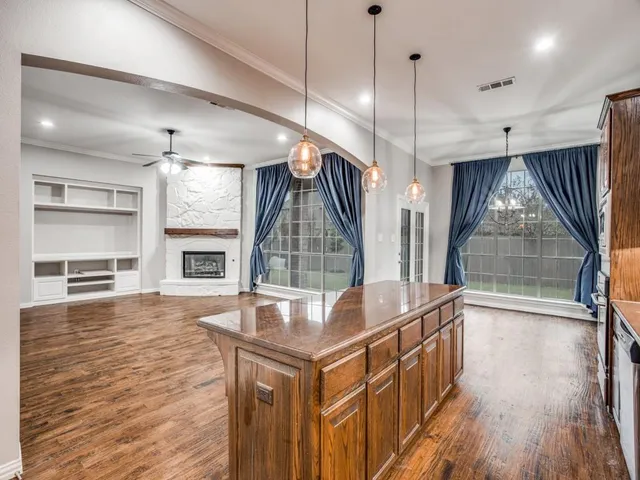 a open kitchen with sink and refrigerator