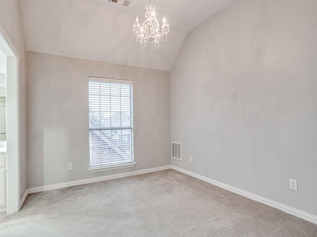 9609 Sam Bass Trail Fort Worth, TX 76244 - Photo 17 of 26 an empty room with windows and chandelier