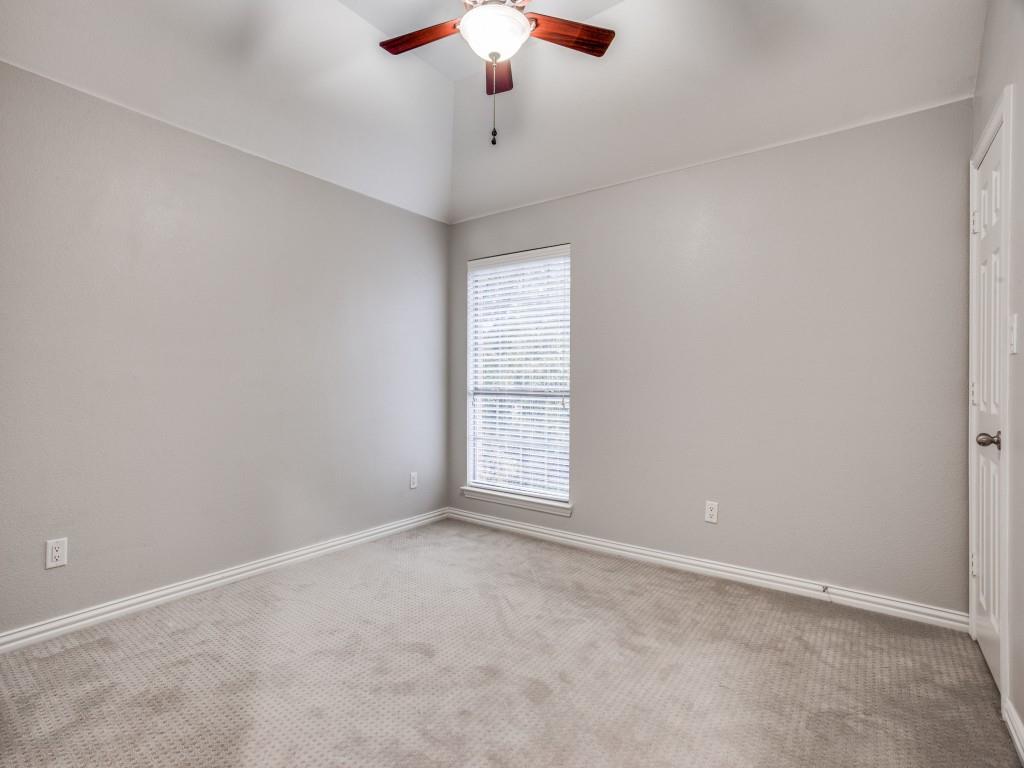 9609 Sam Bass Trail Fort Worth, TX 76244 - Photo 20 of 26 an empty room with a chandelier fan