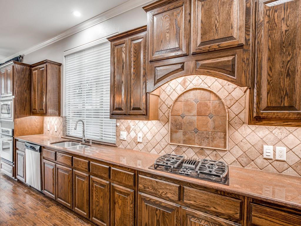 9609 Sam Bass Trail Fort Worth, TX 76244 - Photo 4 of 26 a bathroom with a sink a mirror and shower