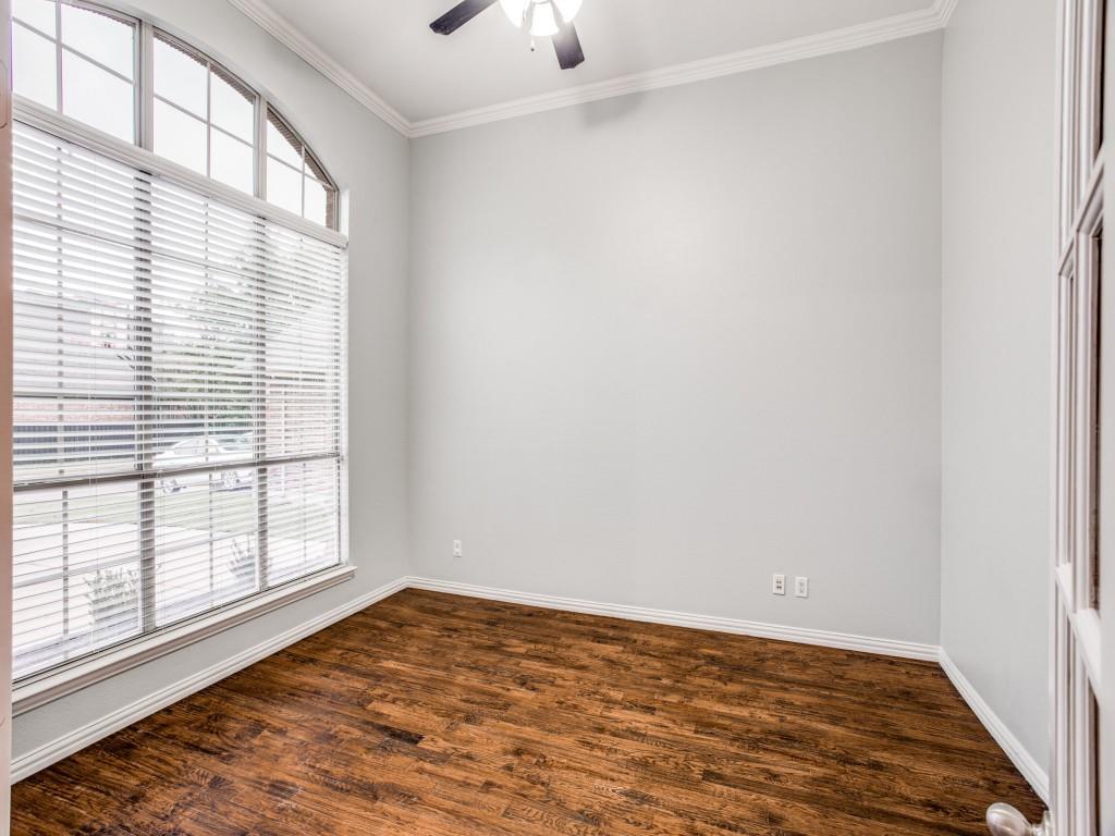 9609 Sam Bass Trail Fort Worth, TX 76244 - Photo 9 of 26 wooden floor in an empty room with a window