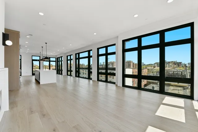 a view of an entryway with wooden floor