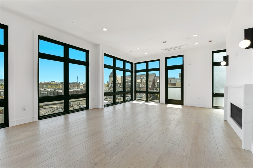 14 Green Street, Unit PH2 Brookline, MA 02446 - Photo 13 of 37 wooden floor in an empty room with a window