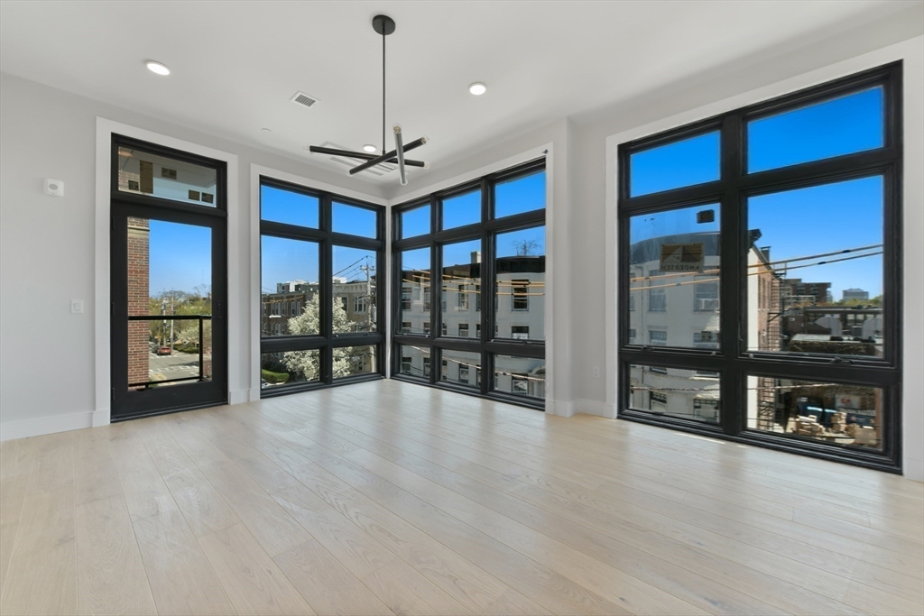 14 Green Street, Unit PH2 Brookline, MA 02446 - Photo 20 of 37 a view of an empty room with glass door
