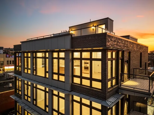 a front view of a house with a glass windows