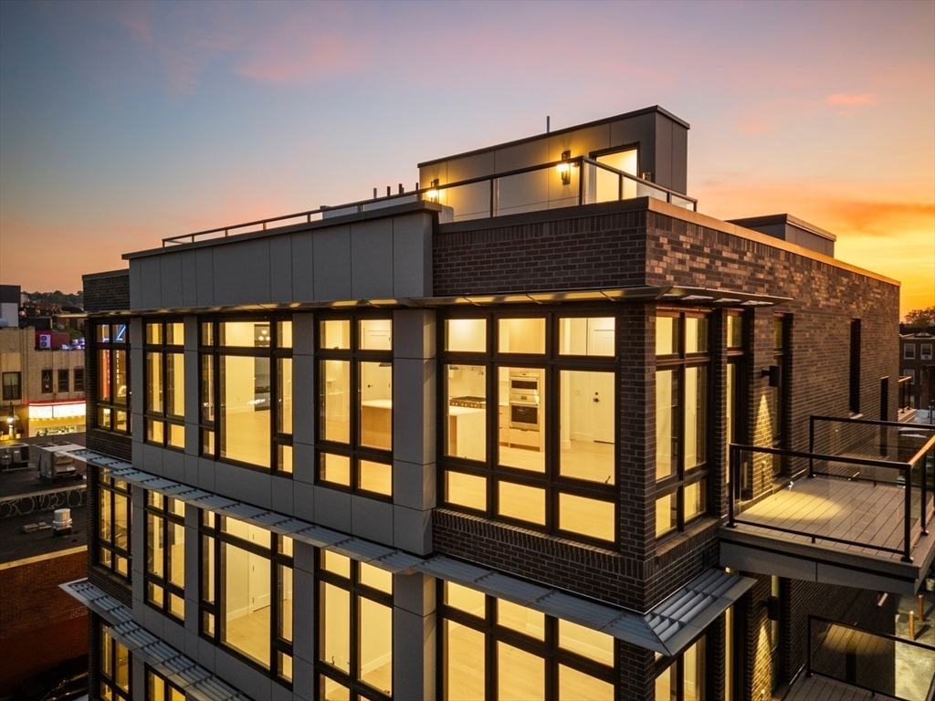14 Green Street, Unit PH2 Brookline, MA 02446 - Photo 2 of 37 a front view of a house with a glass windows