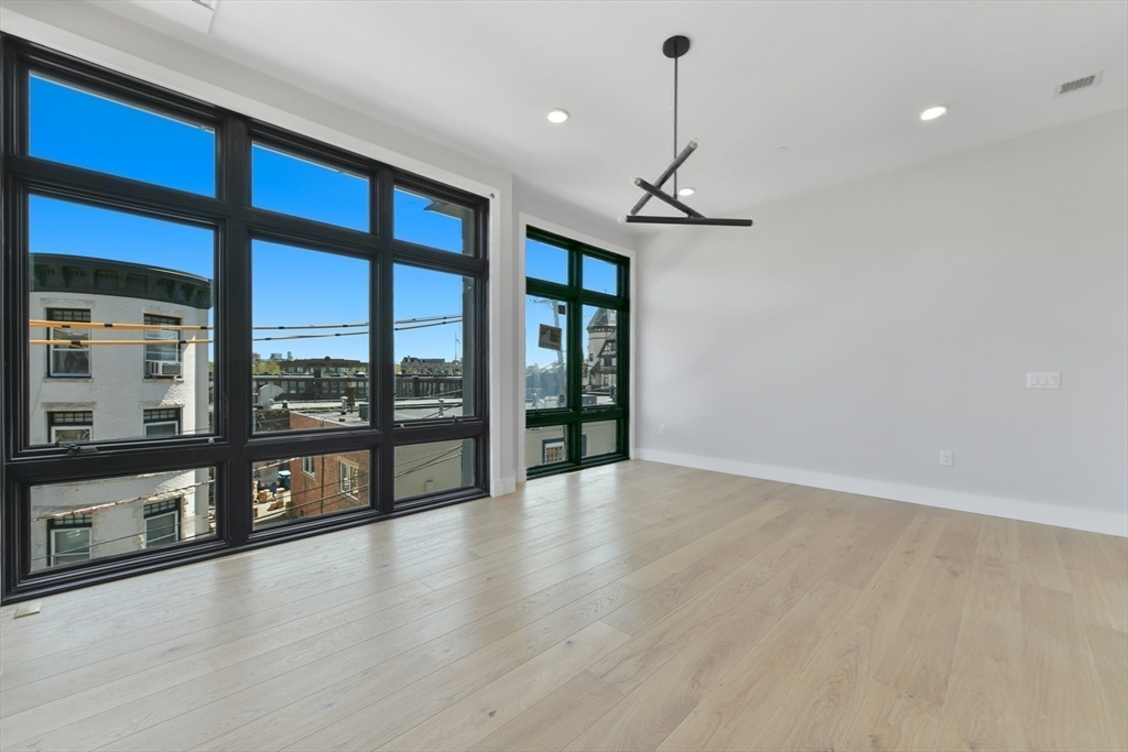 14 Green Street, Unit PH2 Brookline, MA 02446 - Photo 21 of 37 a view of an entryway with wooden floor