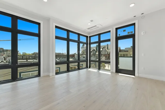 a view of an empty room with a sliding door