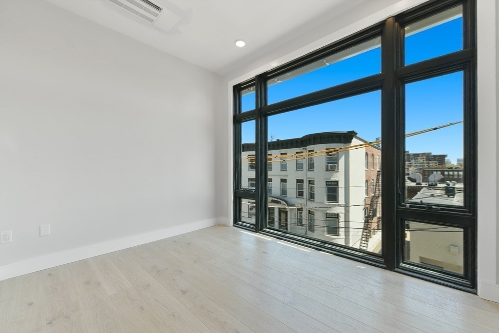 14 Green Street, Unit PH2 Brookline, MA 02446 - Photo 29 of 37 a view of an empty room with glass door