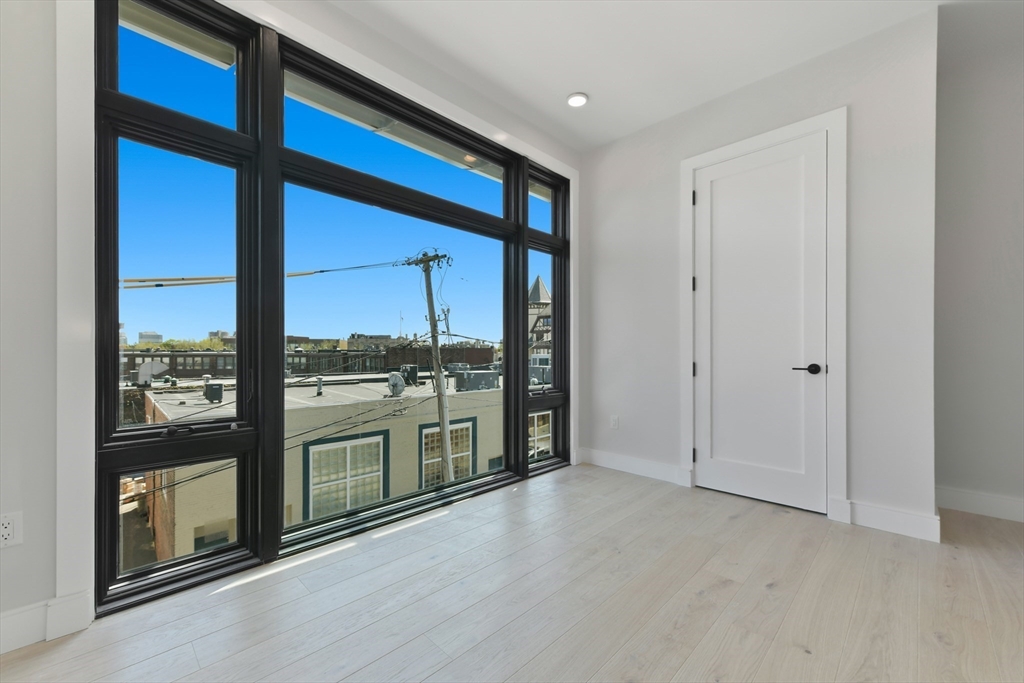 14 Green Street, Unit PH2 Brookline, MA 02446 - Photo 30 of 37 a view of a living room washer and dryer