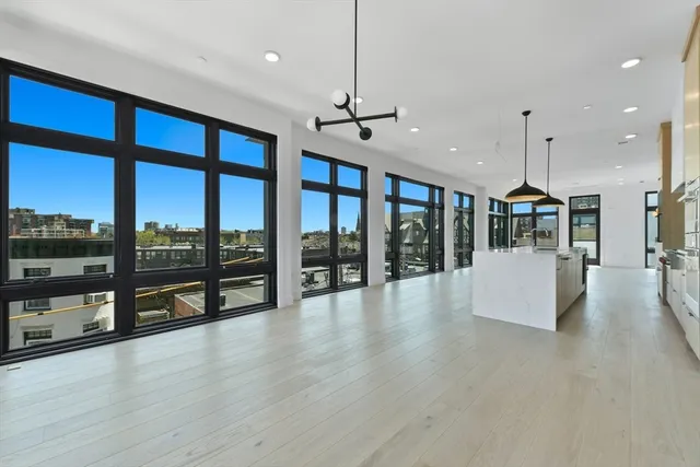 a view of an entryway with wooden floor