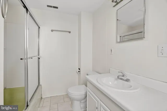 a bathroom with a sink toilet and vanity