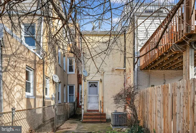 a view of a house with a snow in the yard