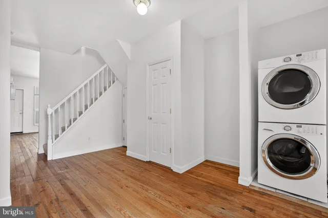 a view of a hallway with washer and dryer