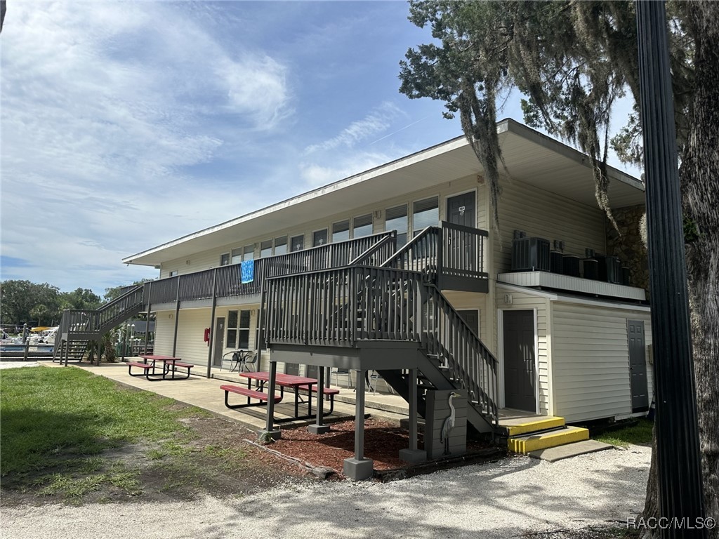 5291 South Cherokee Way Homosassa, FL 34448 - Photo 3 of 27 a front view of a house with garden