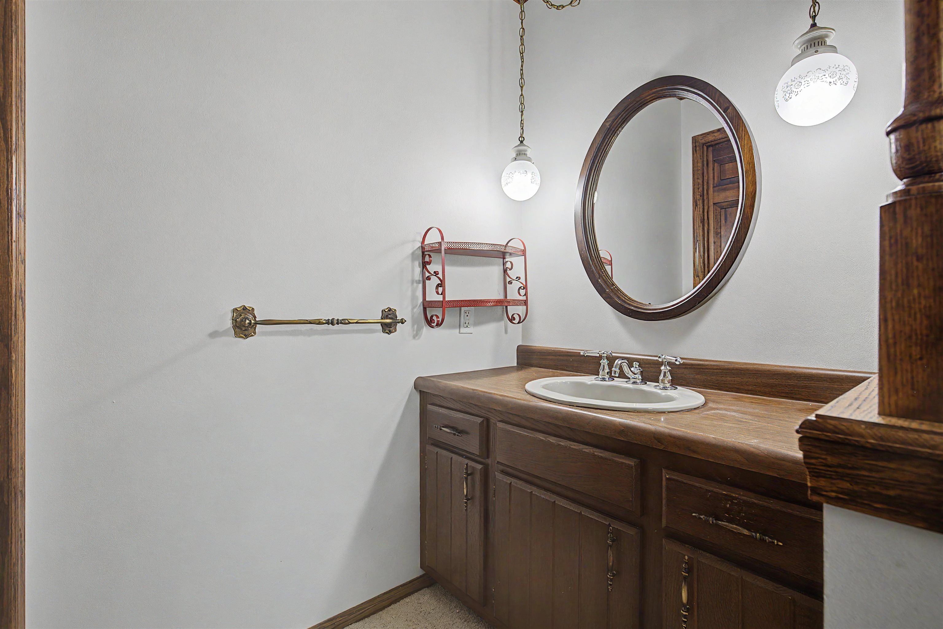 17380 Corbett Road Mount Carroll, IL 61053 - Photo 40 of 65 a bathroom with a sink and a mirror