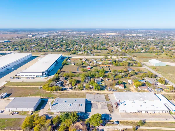 an aerial view of residential building and parking space