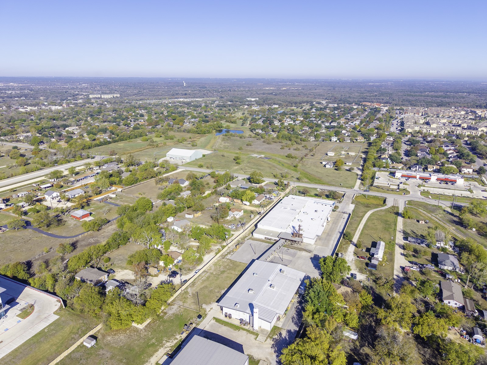 162 Mendoza Lane Buda, TX 78610 - Photo 16 of 19 an aerial view of residential building and parking space