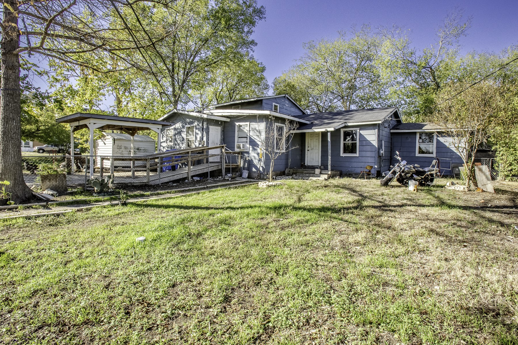 162 Mendoza Lane Buda, TX 78610 - Photo 7 of 19 a view of a house with a yard patio and fire pit