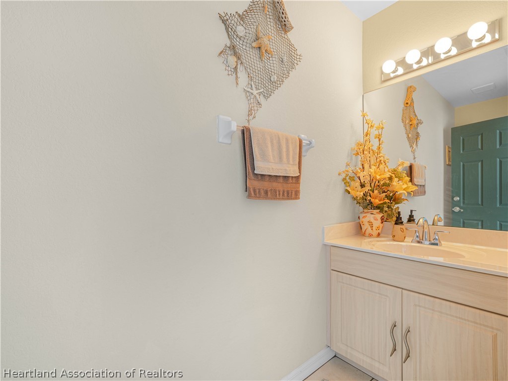 5721 Golden Road Sebring, FL 33875 - Photo 28 of 42 Pool Bath - 1/2 Ba - Commode & Vanity