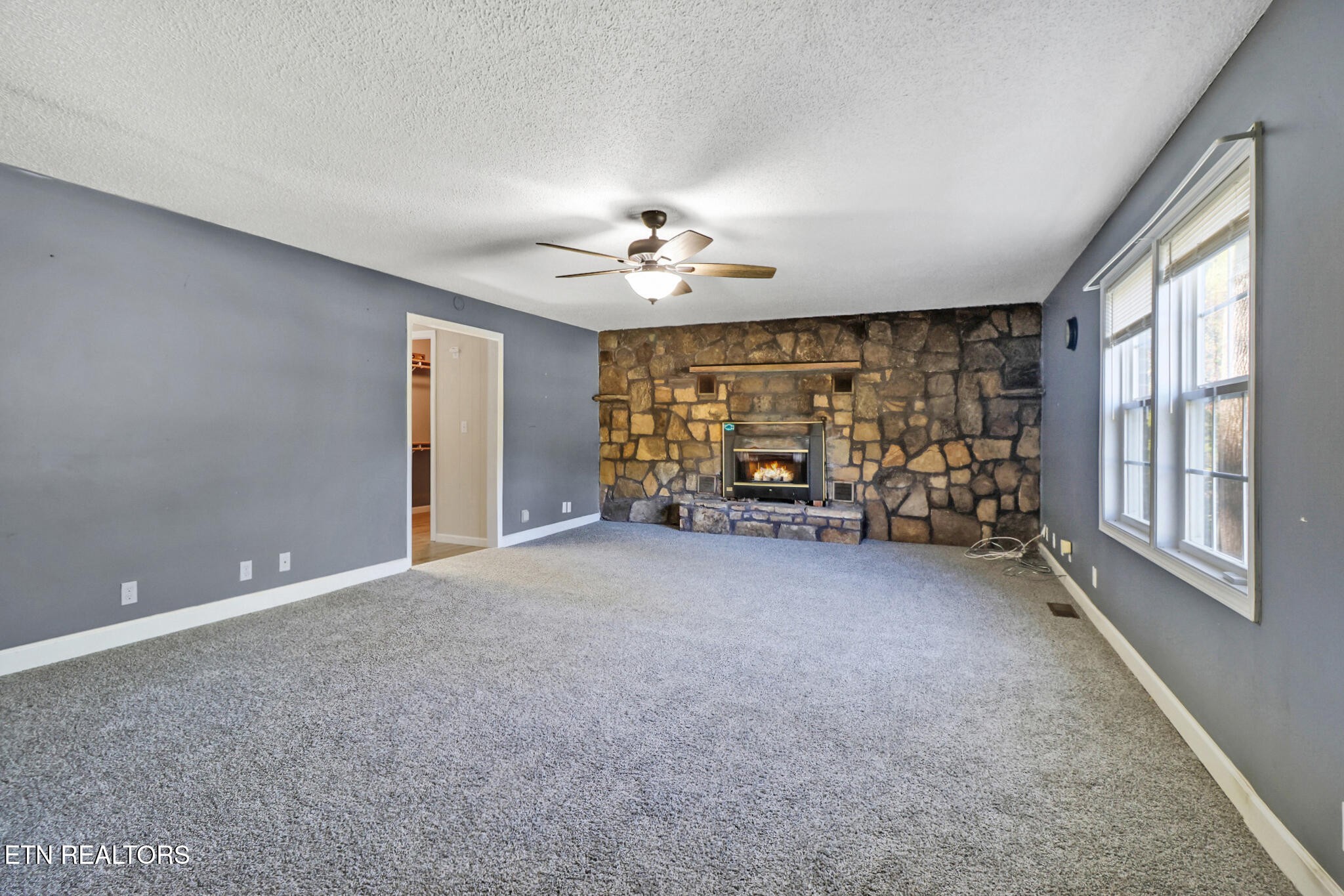 1271 Gouldstown Road Jamestown, TN 38556 - Photo 16 of 52 a view of a livingroom with a ceiling fan and window
